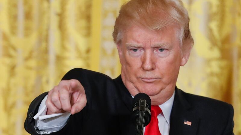 President Donald Trump points to a member of the media during a news conference in the White House on Thursday. Photograph: Pablo Martinez Monsivais/AP