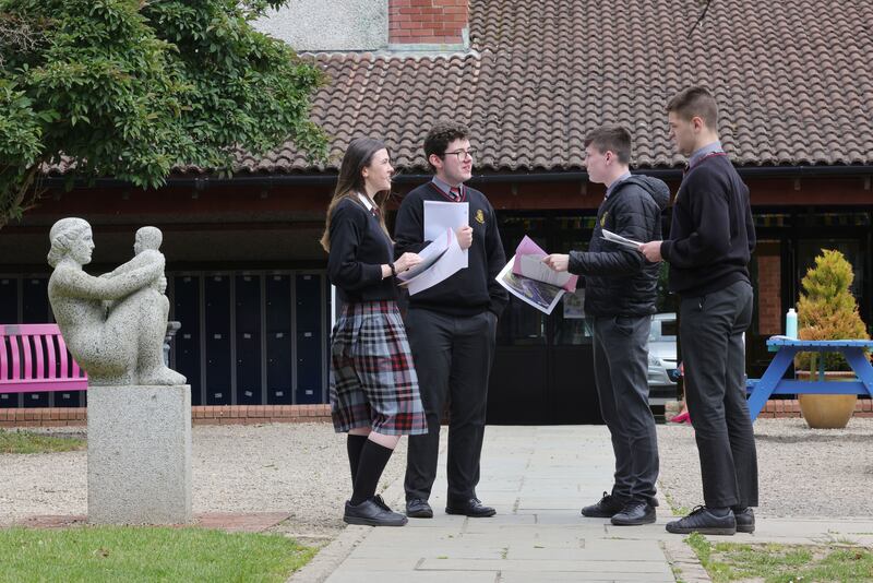 Leaving Certificate students Sophie Keegan, Cian Tuohy, Robert Keher and Christian Jennings  discuss their Leaving Certificate exam at Lucan Community College. Photograph: Alan Betson