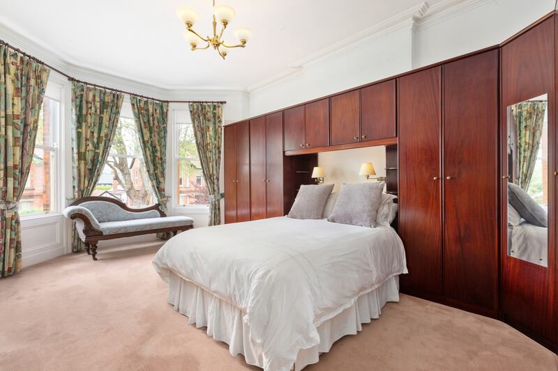 The main bedroom has a fine bay window