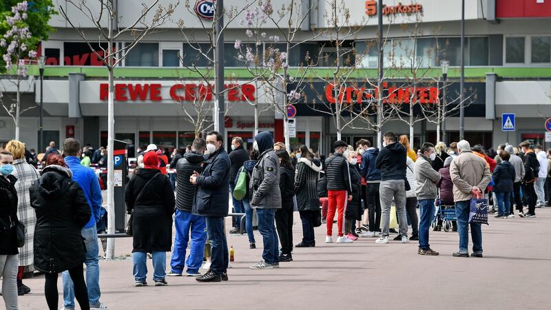 Hundreds of people wait in lines at a vaccination mobile in Cologne, Germany. Photograph: Martin Meissner/AP Photo