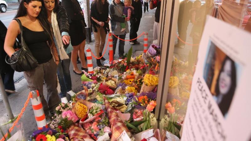 Floral tributes to Jill Meagher outside the Duchess boutique in Melbourne, the store which captured the last CCTV footage of her. Photograph: Scott Barbour/Getty Images