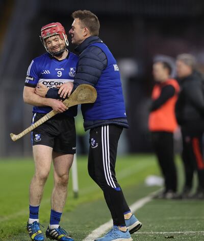 Sarsfields’ Daniel Kearney and manager Johnny Crowley celebrate late in the game during the victory over Ballygunner at Thurles. Photograph: James Crombie/Inpho 