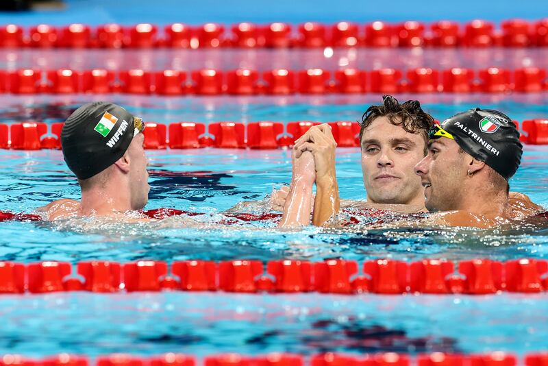 Daniel Wiffen with USA’s Bobby Finke and Italy’s Gregorio Paltrinieri after the men's 1500m freestyle final. Photograph: Morgan Treacy/Inpho