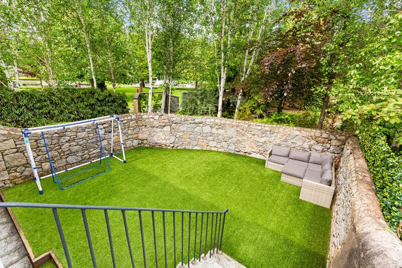 The back garden has an Astroturf lawn