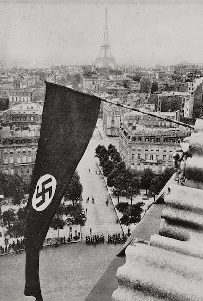 A flag with the swastika hangs from the Arc de Triomphe in Paris in June 1940. Photograph: DeA/Biblioteca Ambrosiana