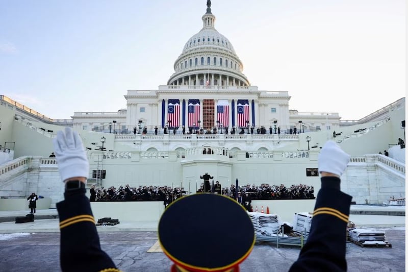 A conductor at a rehearsal in front of the US Capitol before the presidential inauguration of Donald Trump in Washington DC. Photograph: Fabrizio Bensch/Reuters