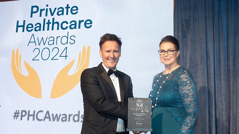 Shay Dalton, managing partner of Medforce, presents the healthcare facility of the year award to Dr Pamela McHenry, Belfast Skin Clinic.