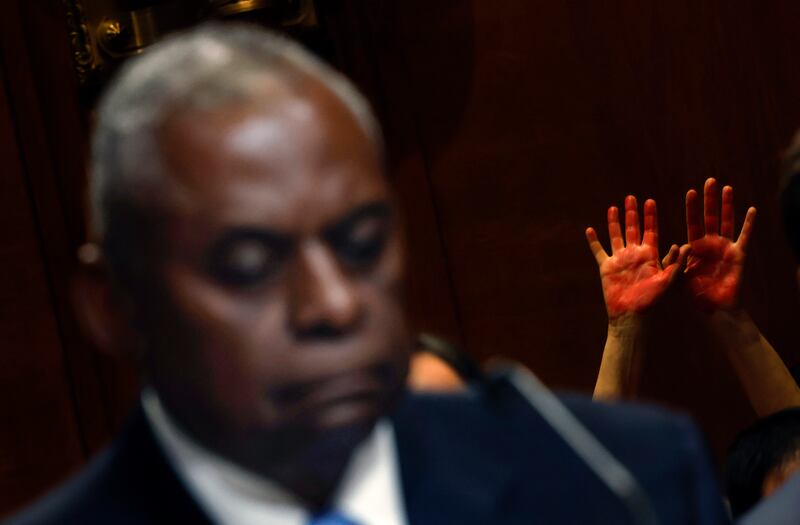 A pro-Palestinian demonstrator puts their hands in the air as US defence  secretaty  Lloyd Austin testifies before the Senate Appropriations Committee on Capitol Hill on Wednesday. Photograph: Kevin Dietsch/Getty Images