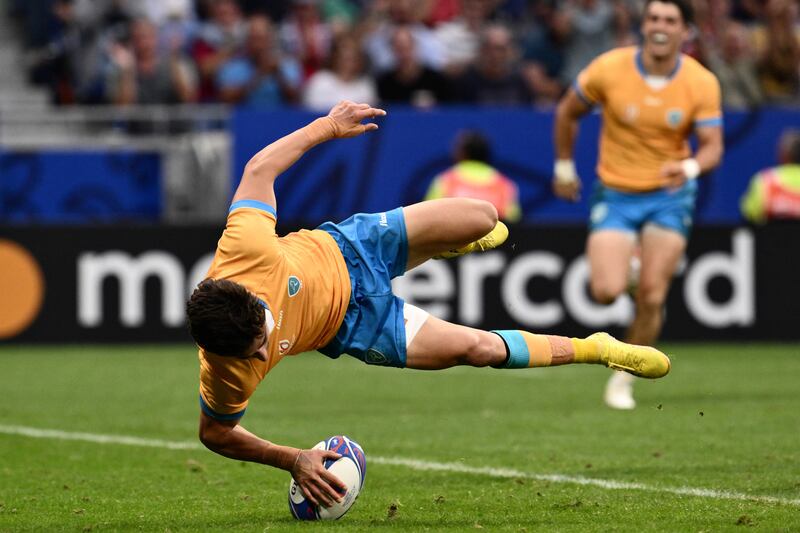 Uruguay's scrumhalf Santiago Arata dives across the line to score a try. Photograph: Jeff Pachoud/AFP via Getty