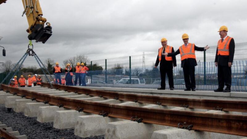 The then minister for transport 0Noel Dempsey and former  chairman of CIE Dr John Lynch  mark the first track being laid on the Dunboyne Commuter Railway at Hansfield Station in  October 2009.