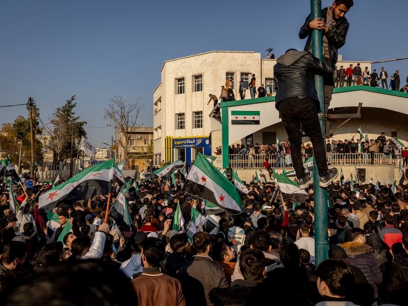 A large crowd celebrates the fall of the Assad government after Friday prayers in the center of Idlib, Syria, on December 13th. Photograph: Ivor Prickett/New York Times