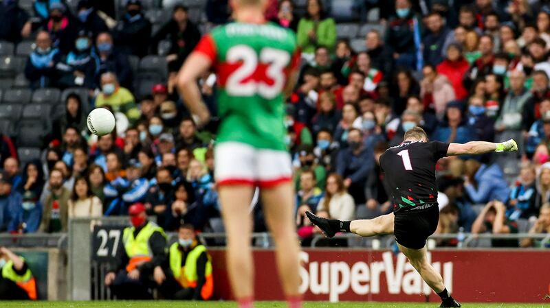 Mayo goalkeeper Rob Hennelly scores a point to put the sides equal and force the game into extra-time. Photograph: James Crombie/Inpho