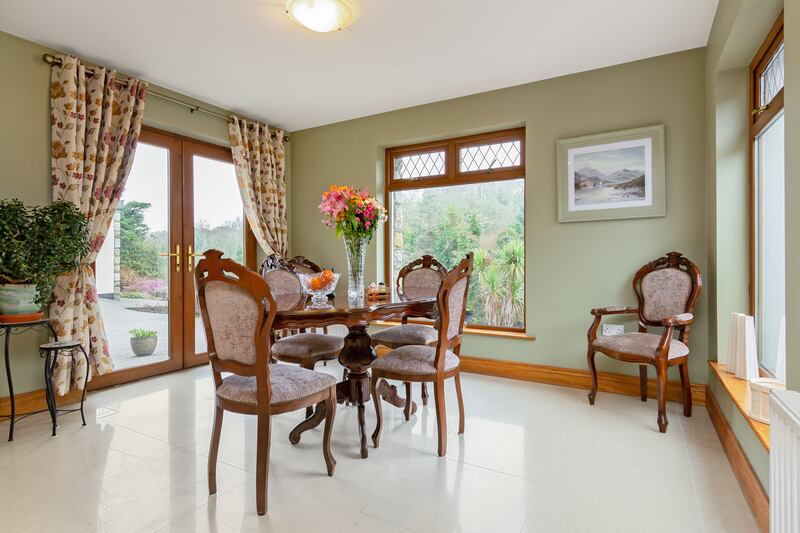 Dining room: High-end fittings throughout the house include solid mahogany doors and polished granite flooring.