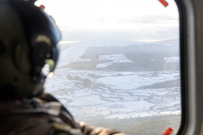 Members of the Air Corps flying over Co Wicklow in the snow. Photograph: Defence Forces