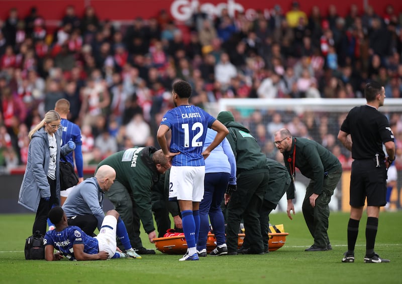 Medical staff attend to Chiedozie Ogbene during Ipswich Town's Premier League fixture against Brentford at Community Stadium. Photograph: Alex Pantling/Getty Images