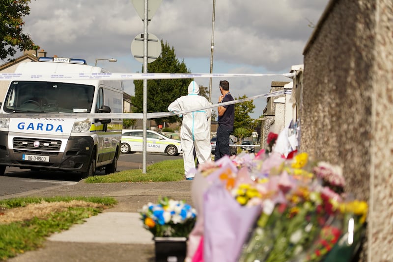 Gardaí investigating the murder scene in west Dublin where eight-year-old twins Chelsea and Christy Cawley and their 18-year-old sister Lisa Cash were murdered in their family home. Photograph: Enda O'Dowd