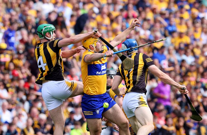 Kilkenny's Tommy Walsh and Mark Rodgers of Clare during their senior championship semi-final at Croke Park. Photograph: Bryan Keane/Inpho