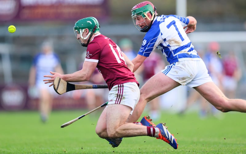 St Martin's Kyle Firman competes against Naas's Kevin Whelan, Photograph: Tom Maher/Inpho