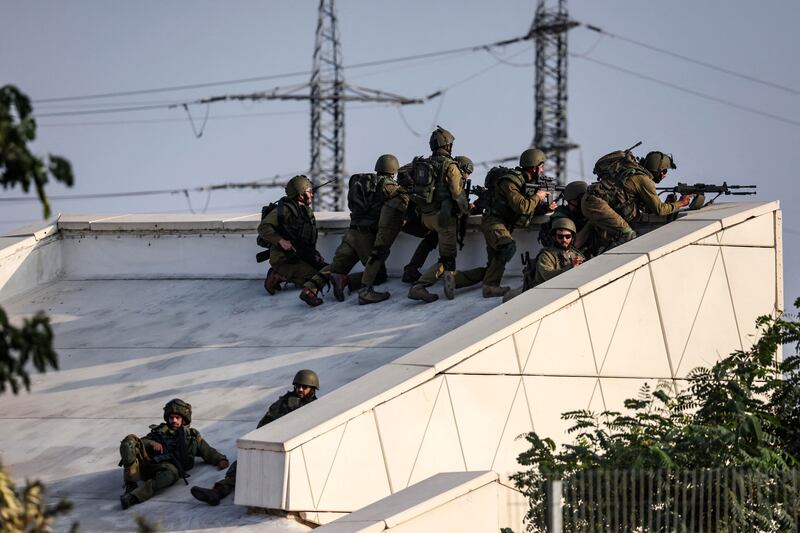 Israeli soldiers take a position near the southern city of Sderot. 
Photograph: Ronaldo Schemidt/ AFP via Getty Images