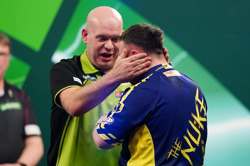 Michael van Gerwen (left) congratulates Luke Littler after winning the World Darts Championship final. Photograph: Zac Goodwin/PA