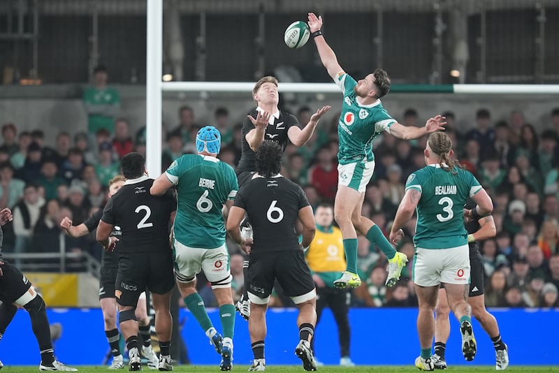 New Zealand's Jordie Barrett and Ireland's Hugo Keenan battle for the ball. Photograph: Niall Carson/PA Wire