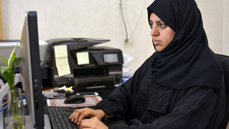 A picture taken on November 26, 2015 shows Nassima al-Sadah, a candidate for municipal councils in the Gulf coast city of Qatif, working at her office in Qatif 400 kilometers east of the Saudi capital, Riyadh. Photograph: STR/AFP/Getty Images