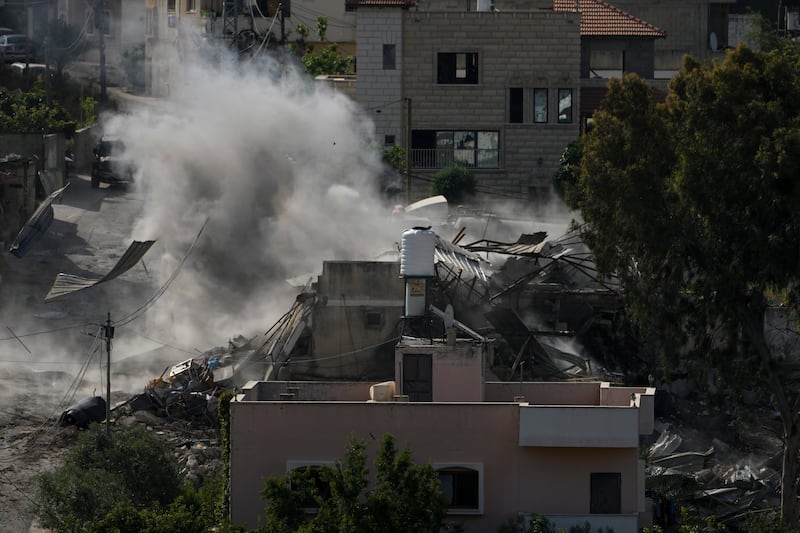 Smoke rises following an explosion during an Israeli military raid in the town of Deir al-Ghusun, near the West Bank town of Tulkarem. Photograph: Majdi Mohammed/AP