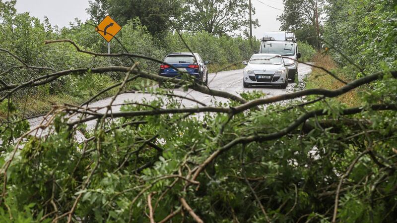 Motorists contend with downed trees on the N72 just outside of Fermoy in Co Cork following Storm Ellen on Wednesday night. Photograph: Damien Storan/PA Wire