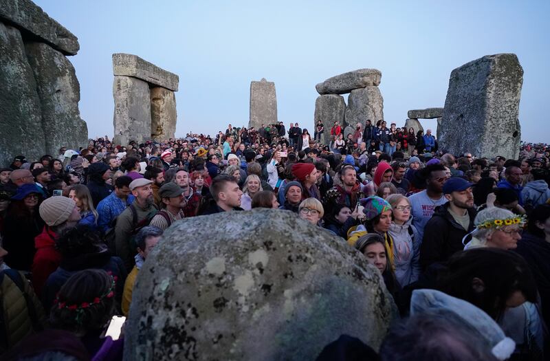 People gather at Stonehenge. Photograph: Andrew Matthews/PA Wire