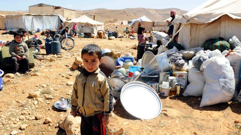 A Syrian boy  who had fled violence at the Syrian town of Flita, near Yabroud, in a camp  at the border town of Arsal,  eastern Bekaa Valley, Lebanon.  Photograph: Hassan Abdallah/Reuters