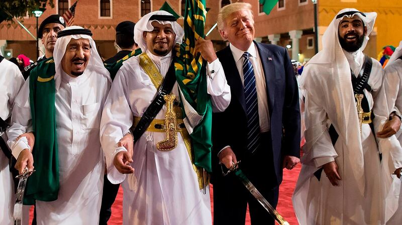 US President Donald Trump and Saudi Arabia’s King Salman (far left) dancing with swords at a welcome ceremony ahead of a banquet at the Murabba Palace in Riyadh last May. Photograph: Saudi Royal Palace handout/ Bandar alJaloud/AFP/Getty Images