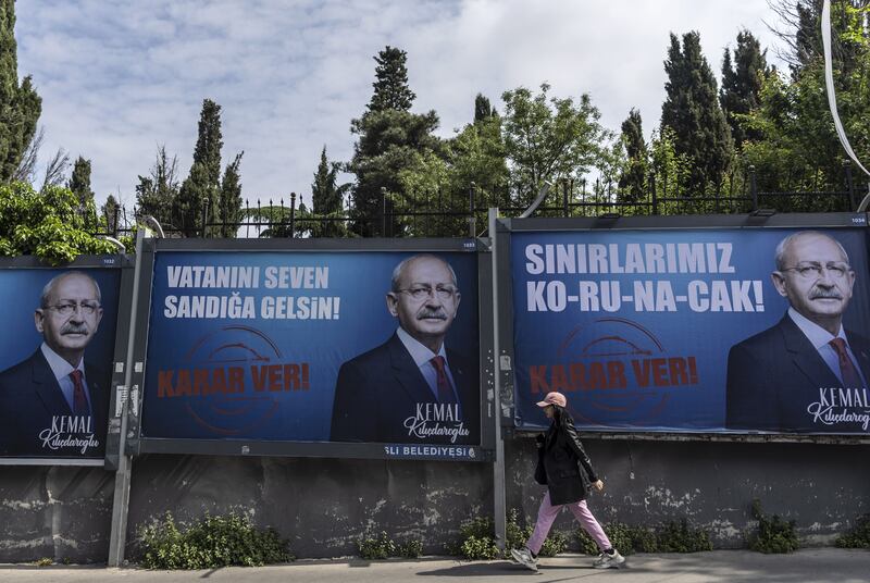 A woman walks in front of election campaign posters of Turkish presidential candidate Kemal Kilicdaroglu, leader of the opposition Republican People's Party, in Istanbul. Photograph: Erdem Sahin