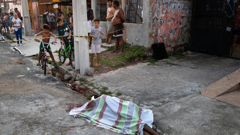 A young man shot twice and killed by an assailant in Belém. Photograph: Tyler Hicks/The New York Times