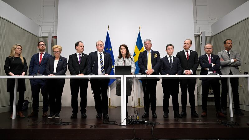 Ten grim-faced politicians including defence minister Peter Hultqvist and foreign affairs minister Ann Linde at Friday’s sombre news briefing. Photograph: Henrik Montgomery/EPA