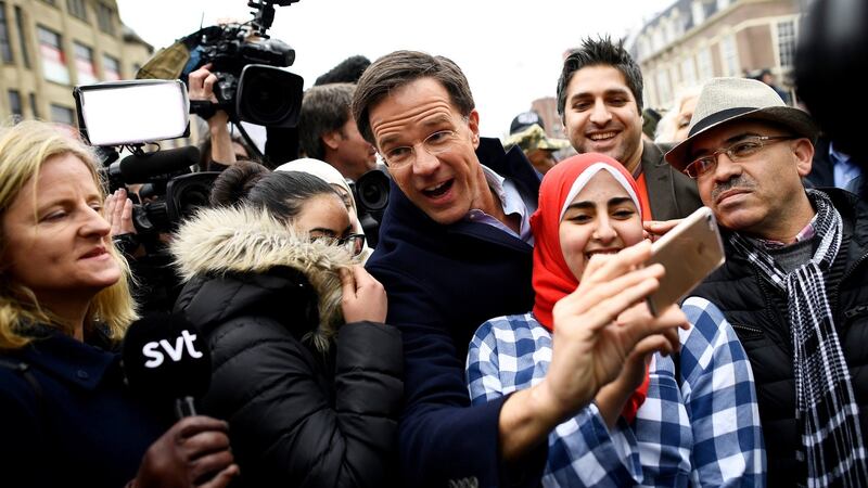 Dutch prime minister Mark Rutte of the VVD Liberal party greets supporters during campaigning in The Hague, Netherlands on Tuesday. Photograph: Reuters