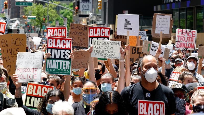 Protestors in Times Square in New York on Sunday. Photograph: Jason Szenes/EPA