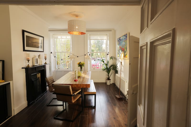 The diningroom overlooks Bram Stoker Park. Atop the dining table is a ceramic Bordallo Pinheiro pumpkin, €130, Howbert and Mays (howbertandmays.ie)