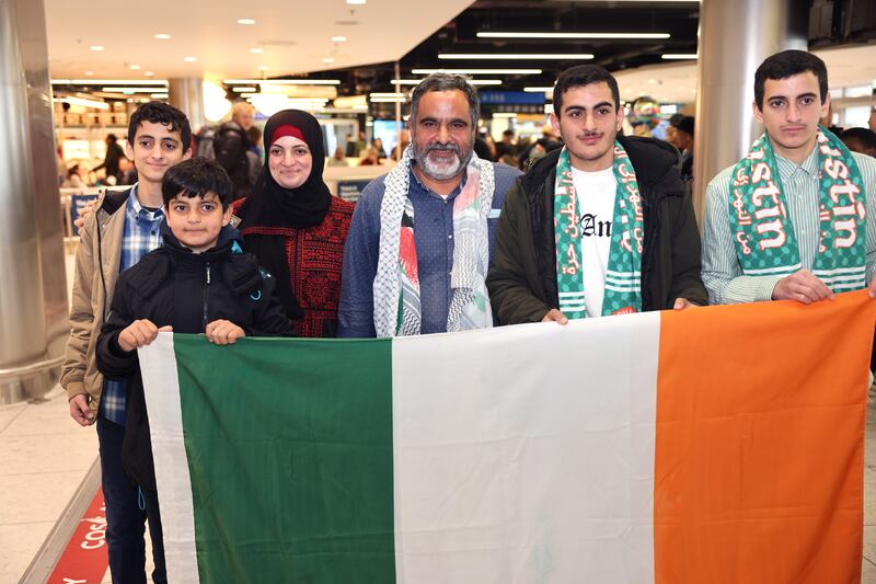 Irish-Palestinian Zak Hania is reunited with his wife, Batoul, and sons, Mazen, (19) Ismael, (17) Ahmed (14) and Nour (11), at Dublin Airport.
Photograph: Dara Mac Dónaill 
