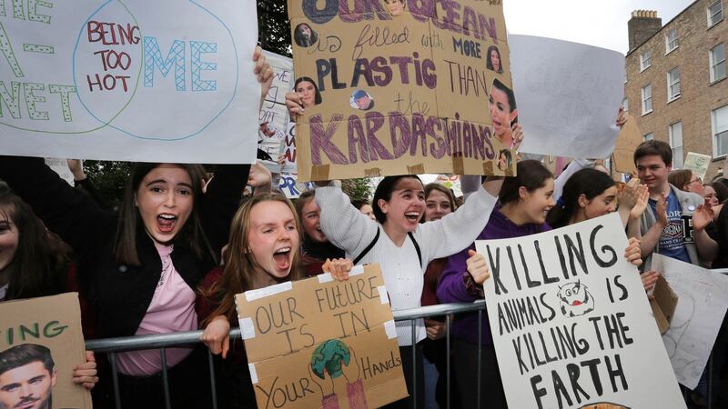 Pictured are members of the Schools Climate Action Network in Merrion Square, Dublin, calling on the Government to take action on the growing climate and biodiversity crisis. File Photograph: Extinction Rebellion Ireland