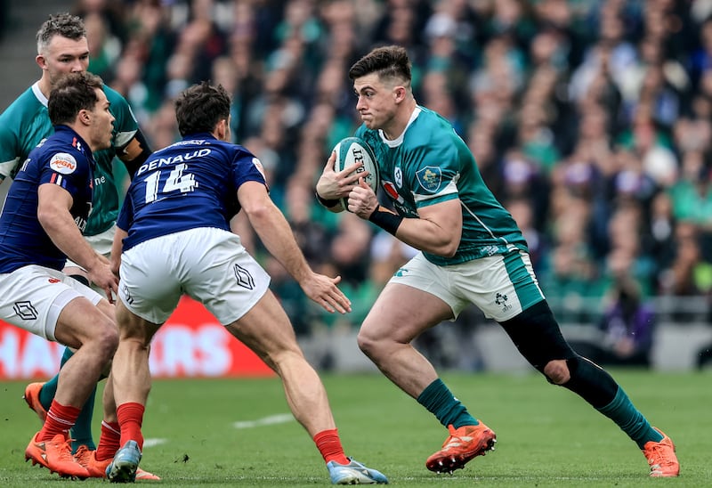 Dan Sheehan comes up against France's Damian Penaud. Photograph: Dan Sheridan/Inpho