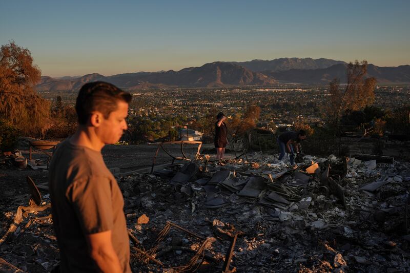 Louie Gonzalez visits what remains of his mother’s home after it was destroyed in the Mountain Fire in Camarillo, Photograph: Jae C Hong/AP