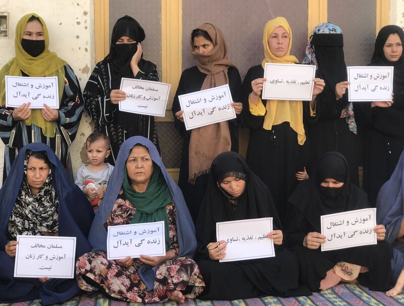 Afghan women hold placards demanding the right to education and work in Mazar-e-Sharif, Afghanistan, August 16th, 2023. Photograph: EPA