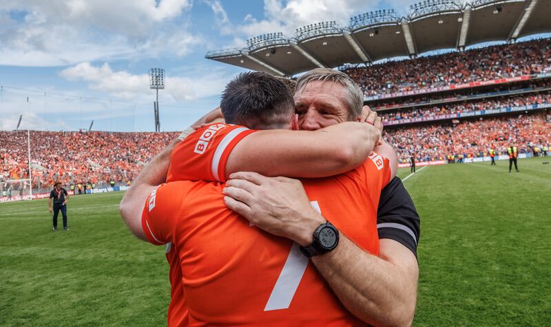 Armagh’s Aidan Forker celebrates with manager Kieran McGeeney after winning the All-Ireland final at Croke Park. Photograph: James Crombie/Inpho