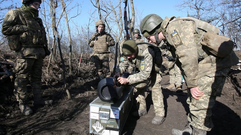 Ukrainian military forces in the Donetsk region examine a Swedish-British portable anti-tank guided missile NLAW that was transferred to the units as part of Britain’s military-technical assistance. Photograph: Anatolii Stepanov/AFP via Getty