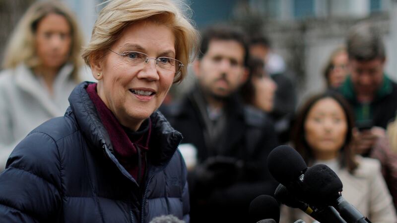 Elizabeth Warren  after announcing she has formed an exploratory committee to run for president in 2020, outside her home in Cambridge, Massachusetts, on Monday. Photograph: Brian Snyder/Reuters