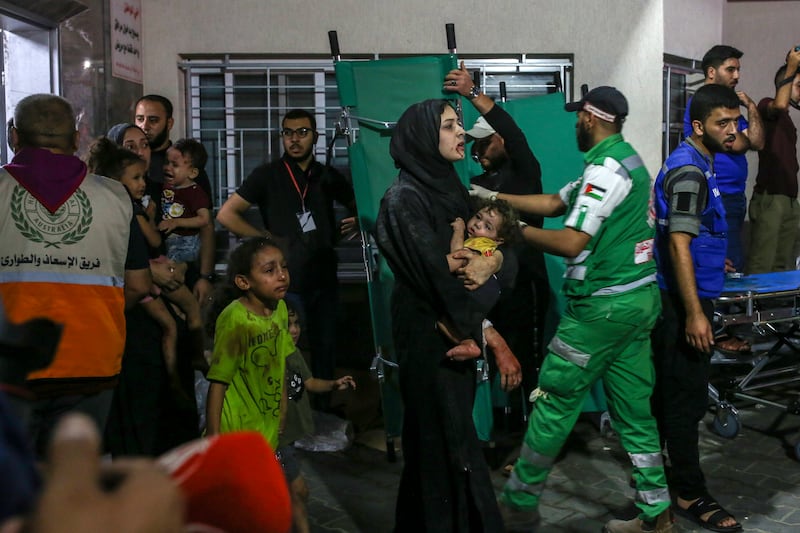 Injured people arrive for treatment at the Al-Shifa Hospital following Israeli air strikes in Gaza City on Wednesda. Photograph: Samar Abu Elouf/New York Times