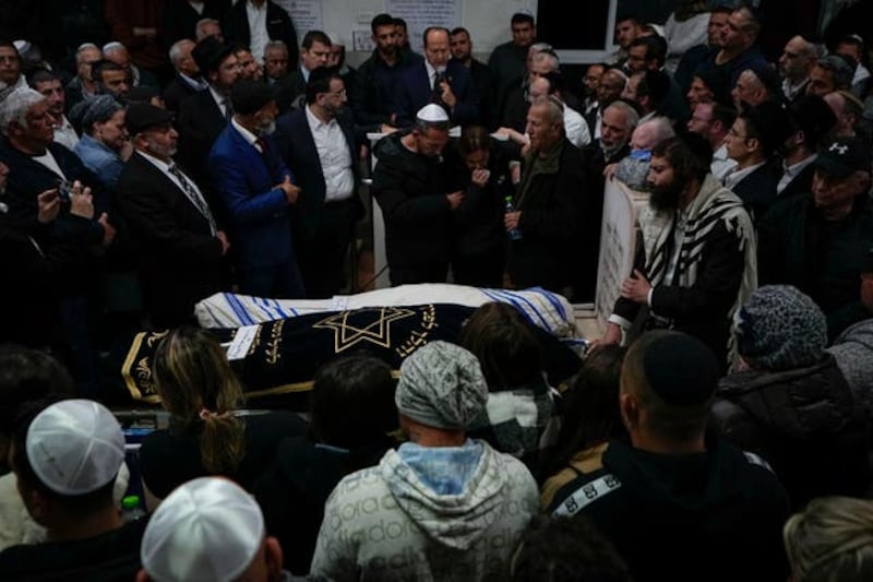 Israeli family members and relatives mourn Eli Mizrahi and his wife Natali Mizrahi who died in the shooting attack. Photograph: PA