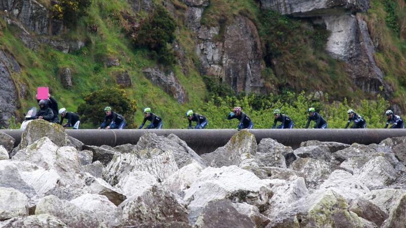 The pack rides along the Antrim Coast Road during the second stage of the 97th Giro d’Italia cycling race, 219 km from Belfast to Belfast. Photograph: Paul McErlane/EPA