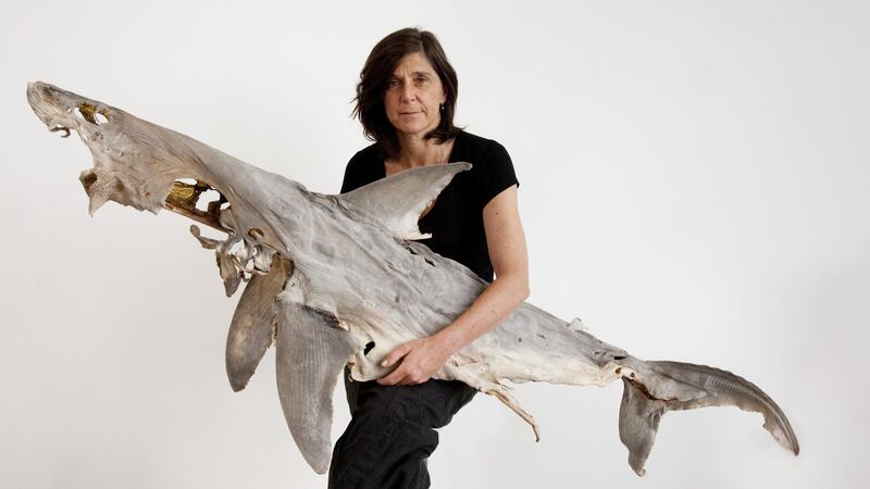 Dorothy Cross holding shark.  Photograph:  Sue Flood