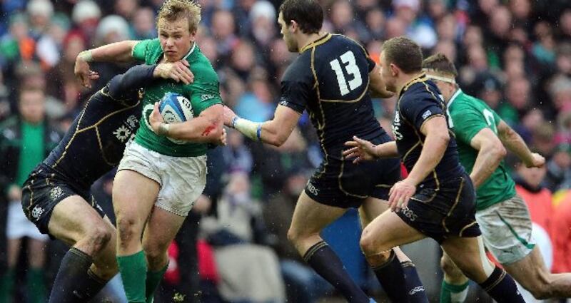 Luke Marhsall is tackled by Scotland's Tim Visser in Murrayfield.